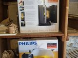 two boxes of philips coffee machines on a shelf