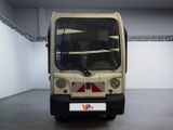 a small bus that is parked inside of a building