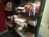 a shelf with many items on it in a room