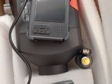 an image of a cell phone in the back seat of a car