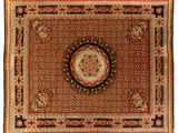 a brown rug with a medallion on top of it