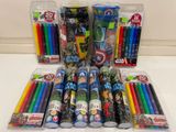 a lot of pencils and pens sitting on a table