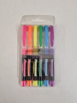 six different colored markers in a plastic case