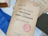 an old book sitting on top of a table next to other items