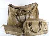 three pieces of luggage sitting next to each other on a white surface