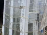 an image of a large window being loaded onto a pallet