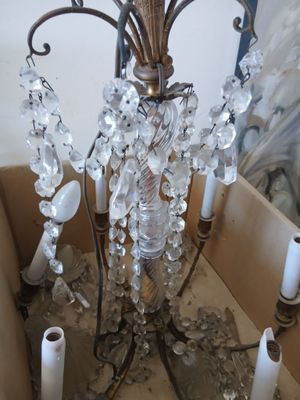 a large crystal chandelier that is in a box