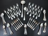 a lot of forks and spoons arranged in a circle
