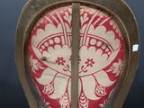 a chair that has a red and white pattern on it