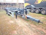 a trailer with a trailer attached to it in a field