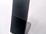 a cell phone that is sitting on top of a stand
