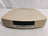 a beige radio that is sitting on top of a table