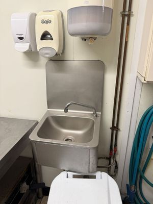 a sink and a toilet in a small room