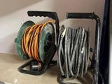 a hose and a reel sitting on the floor