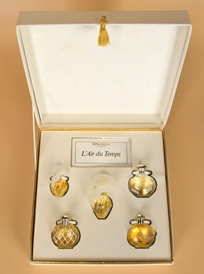 an image of a box containing a set of gold glass ornaments