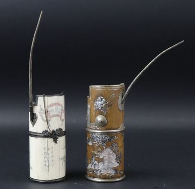 pair of silver and ivory vases with handles and handles