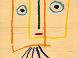 une image représentant un dessin d'un visage sur une feuille de papier