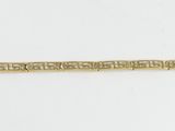 a gold bracelet with an intricate design on it