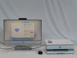 a desktop computer and a printer sitting on a table