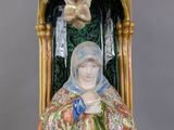 an image of a statue of a woman with a bird above her head