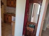 a bathroom with a sink and a mirror in it