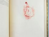 an open book with a drawing of a woman on it