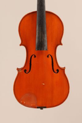 an old violin with a bow hanging from it ' s back