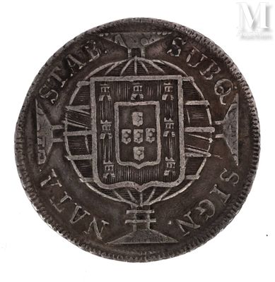 an old silver coin with a coat of arms on it