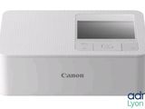 the canon photo printer is white and has a digital screen