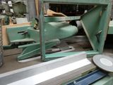 an image of a machine that is working on a piece of metal