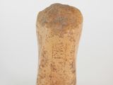 a close up of a wooden object on a white surface