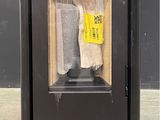 a black trash can with a yellow sticker on it