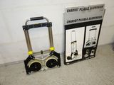 a box and a cart sitting next to each other on the floor