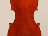an antique violin with a wooden back and bow