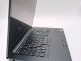 a laptop computer sitting on top of a white table