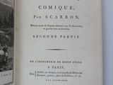 an open book with a black and white image of a man and a woman