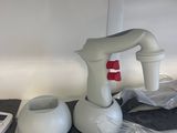 a plastic bag on the counter with a blender and other items
