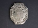 an old silver coin with the words ' the national best ' engraved on it