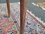 a rug on the floor and a table on the floor