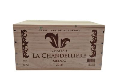 a wooden box with a label on it that says chateau la chandeliere