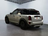 a silver mini cooper parked inside of a building