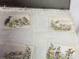 four cards in a box with pictures of animals on them