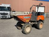 a tractor and a dump truck in a parking lot