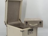 an open suitcase sitting on top of a white surface
