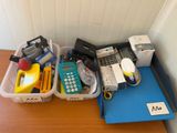 two bins filled with various items on a table