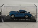 a blue model of a car in a clear case