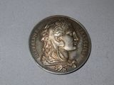 a coin with a woman ' s head on it