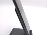 a cell phone that is sitting on top of a stand