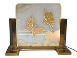 two butterflies on a glass plate with a metal stand