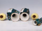three vases sitting next to each other on a table